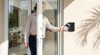 Employee using iPhone mobile credential at a Sarasota office reader